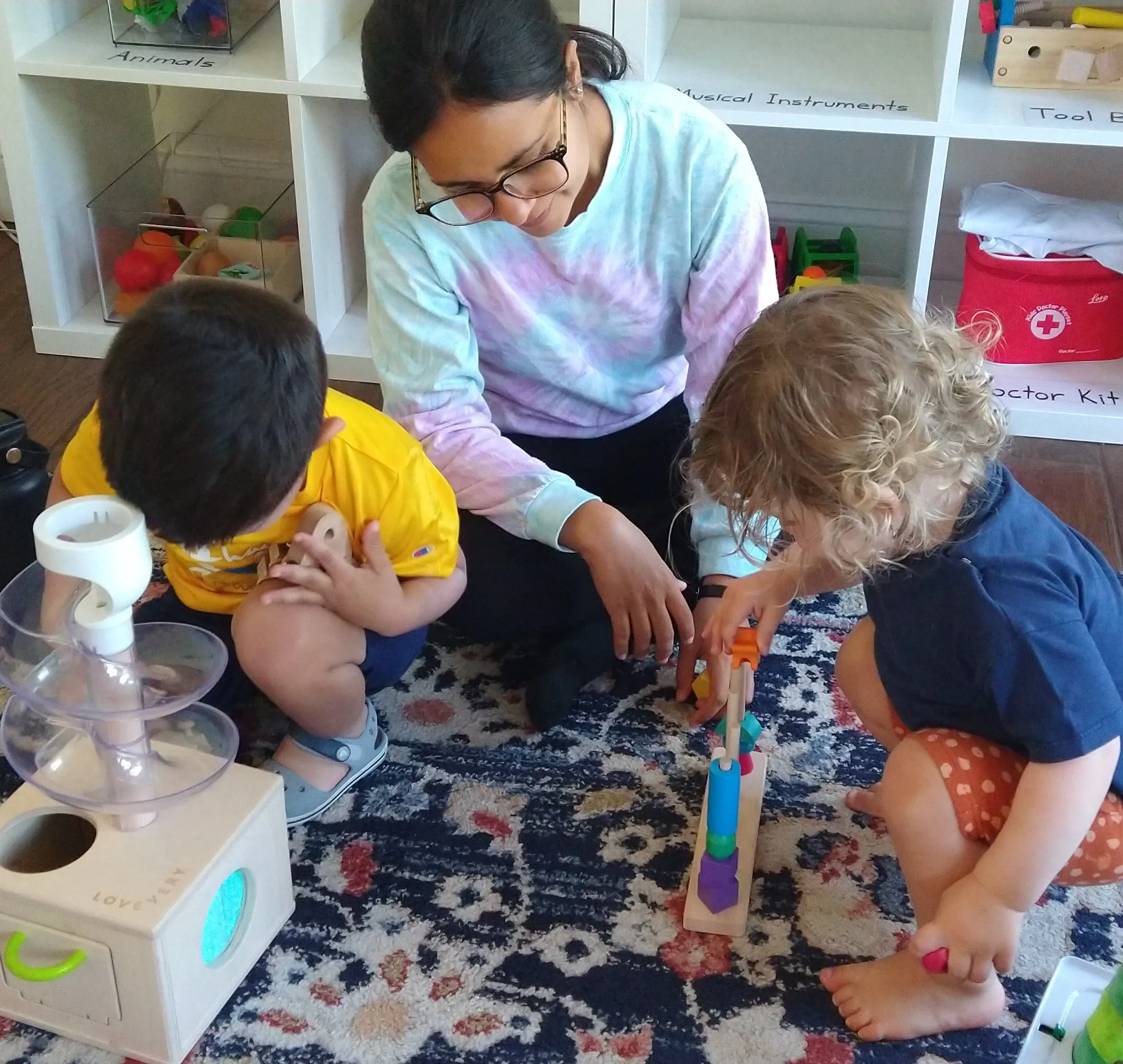 Nora Delgado engaging with children through play-based learning activities